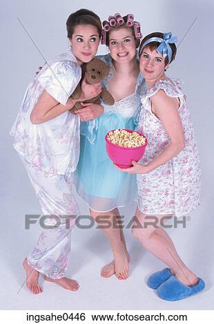 Smiling girls at slumber party View Large Photo Image Stock Photograph - Smiling girls at slumber party. Fotosearch
