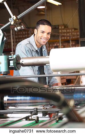 Smiling man operating machinery 1 View Large Photo Image Stock Image - Smiling man operating machinery 1. Fotosearch
