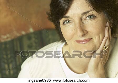 Smiling woman in white sweater View Large Photo Image Stock Photography - Smiling woman in white sweater. Fotosearch