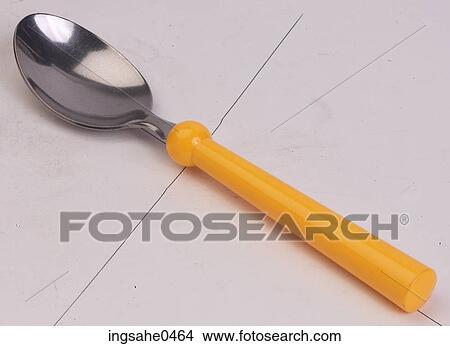 Spoon with yellow plastic handle L1 View Large Photo Image Picture - Spoon with yellow plastic handle L1. Fotosearch