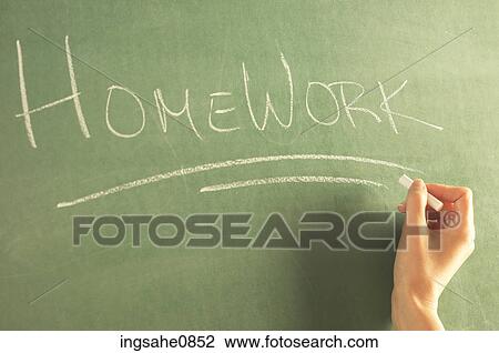 Teacher writing homework on green chalkboard View Large Photo Image Stock Image - Teacher writing homework on green chalkboard. Fotosearch