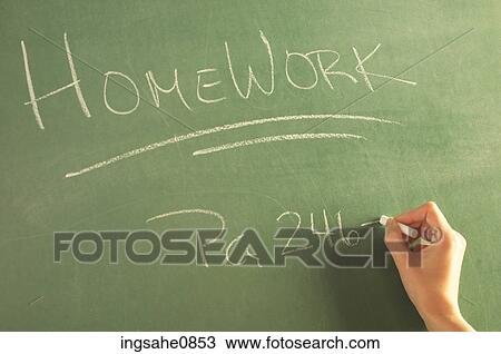 Teacher writing homework on green chalkboard 1 View Large Photo Image Stock Image - Teacher writing homework on green chalkboard 1. Fotosearch