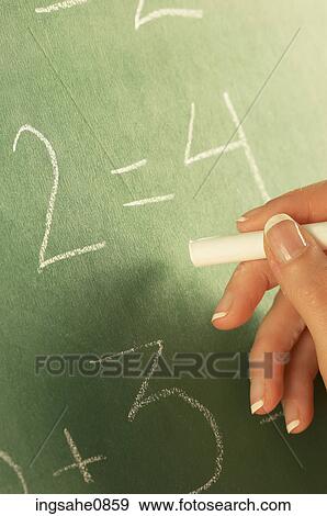 Teacher writing math equation on chalkboard View Large Photo Image Stock Photo - Teacher writing math equation on chalkboard. Fotosearch