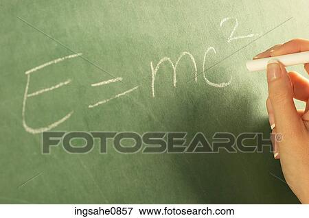 Teacher writing physics equation on chalkboard View Large Photo Image Stock Photo - Teacher writing physics equation on chalkboard. Fotosearch