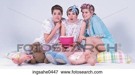 Teenaged girls watching scary movie 1 View Large Photo Image Stock Photo - Teenaged girls watching scary movie 1. Fotosearch
