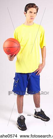 Teenager holding basketball  View Large Photo Image Picture - Teenager holding basketball . Fotosearch