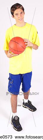 Teenager holding basketball View Large Photo Image Stock Image - Teenager holding basketball . Fotosearch