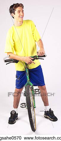 Teenager on bicycle View Large Photo Image Stock Image - Teenager on bicycle . Fotosearch