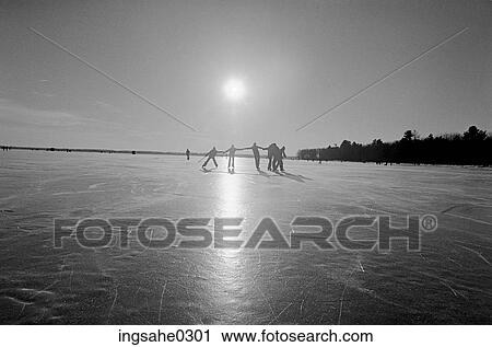 Stock Image - Teenagers skating together . Fotosearch