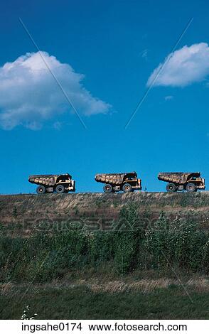 Three dump trucks View Large Photo Image Picture - Three dump trucks . Fotosearch