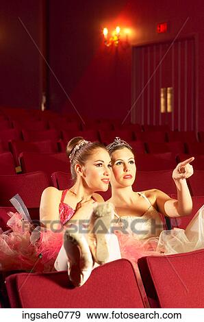 Two ballerinas sitting in red theater View Large Photo Image Stock Photo - Two ballerinas sitting in red theater. Fotosearch