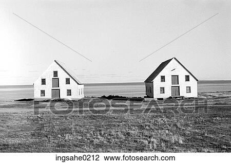 Stock Image - Two barns in field . Fotosearch