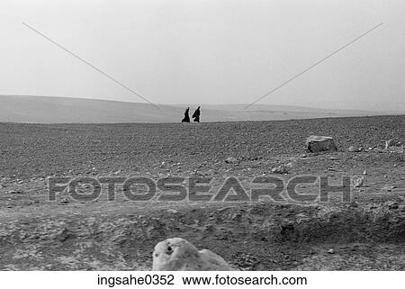 Two women walking in desert View Large Photo Image Stock Image - Two women walking in desert . Fotosearch