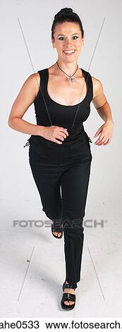 Woman running and smiling L1 View Large Photo Image Stock Image - Woman running and smiling L1. Fotosearch