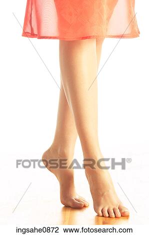 Woman tiptoeing across floor in bare feet 2 View Large Photo Image Stock Image - Woman tiptoeing across floor in bare feet 2. Fotosearch