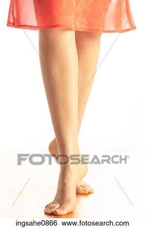 Woman tiptoeing across floor in bare feet View Large Photo Image Stock Photograph - Woman tiptoeing across floor in bare feet. Fotosearch