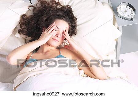 Stock Photo - Woman waking up. Fotosearch