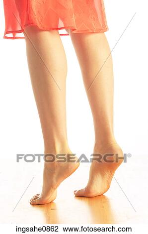 Woman's bare tiptoe feet in orange skirt View Large Photo Image Stock Image - Woman's bare tiptoe feet in orange skirt. Fotosearch