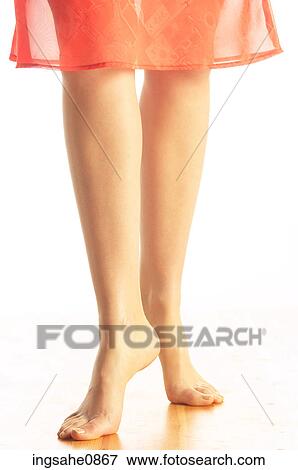 Woman's bare tiptoe feet in orange skirt 2 View Large Photo Image Stock Photo - Woman's bare tiptoe feet in orange skirt 2. Fotosearch