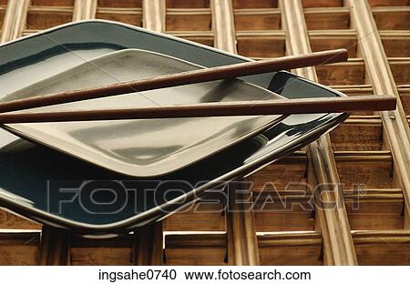 Wooden chopsticks on green china dishes View Large Photo Image Stock Image - Wooden chopsticks on green china dishes. Fotosearch