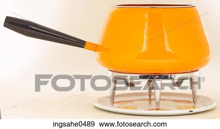 Stock Photo - Yellow fondue pot L1. Fotosearch