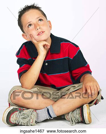 boy sitting on ground View Large Photo Image Stock Photo - boy sitting on ground . Fotosearch