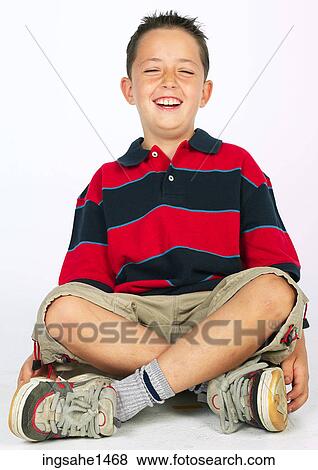 boy sitting on ground View Large Photo Image Stock Photo - boy sitting on ground . Fotosearch