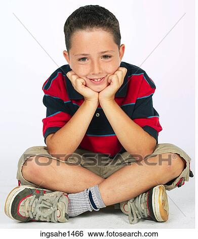 boy sitting on ground View Large Photo Image Stock Photograph - boy sitting on ground . Fotosearch