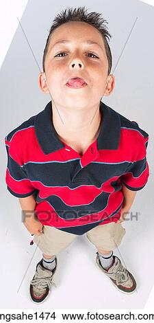 Picture - boy standing with stripped shirt . Fotosearch
