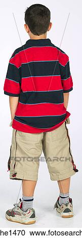 Stock Image - boy standing with stripped shirt . Fotosearch
