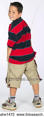 boy standing with stripped shirt View Large Photo Image Stock Image - boy standing with stripped shirt . Fotosearch