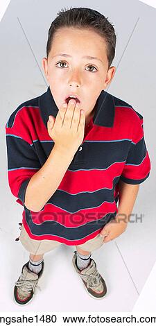 Stock Image - boy standing with stripped shirt . Fotosearch