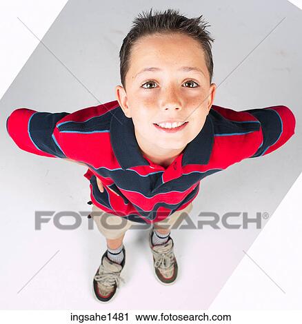 Stock Image - boy standing with stripped shirt . Fotosearch
