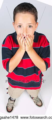 Stock Photo - boy standing with stripped shirt . Fotosearch