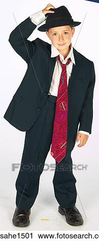 boy wearing adult suit View Large Photo Image Stock Image - boy wearing adult suit . Fotosearch