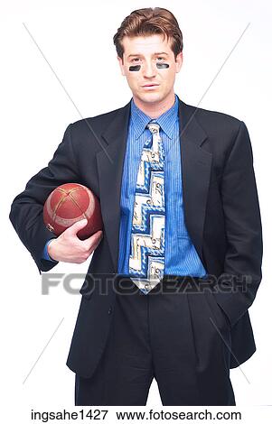 Stock Photo - business man with football L2. Fotosearch