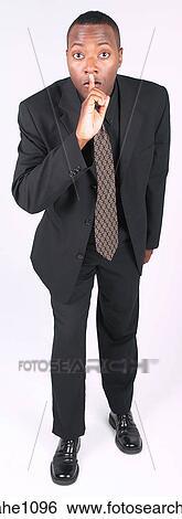 Stock Photograph - Businessman asking for silence a81. Fotosearch
