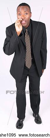 Businessman cupping mouth View Large Photo Image Stock Photography - Businessman cupping mouth. Fotosearch