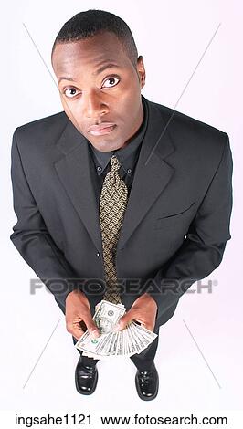 Businessman holding money a81 View Large Photo Image Stock Image - Businessman holding money a81. Fotosearch
