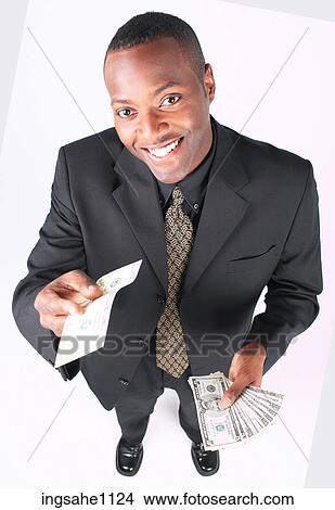 Businessman holding money a84 View Large Photo Image Picture - Businessman holding money a84. Fotosearch