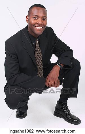 Stock Image - Businessman squatting a82. Fotosearch
