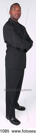 Businessman standing with arms crossed View Large Photo Image Stock Photography - Businessman standing with arms crossed. Fotosearch