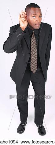 Picture - Businessman trying to hear a81. Fotosearch