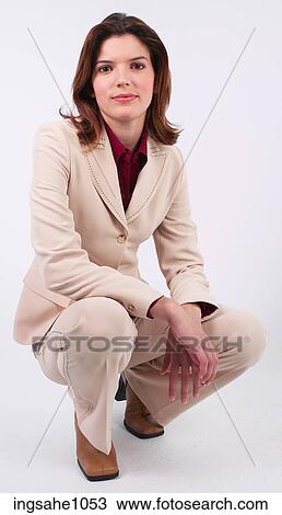 Businesswoman kneeling a81 View Large Photo Image Stock Image - Businesswoman kneeling a81. Fotosearch