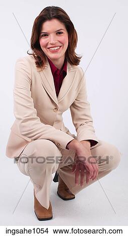 Businesswoman kneeling a82 View Large Photo Image Picture - Businesswoman kneeling a82. Fotosearch