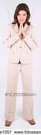 Businesswoman standing with hands folded View Large Photo Image Stock Photo - Businesswoman standing with hands folded. Fotosearch