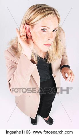 Businesswoman trying to hear View Large Photo Image Stock Image - Businesswoman trying to hear. Fotosearch