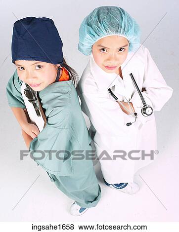 Stock Photo - children dressed as doctors BE. Fotosearch