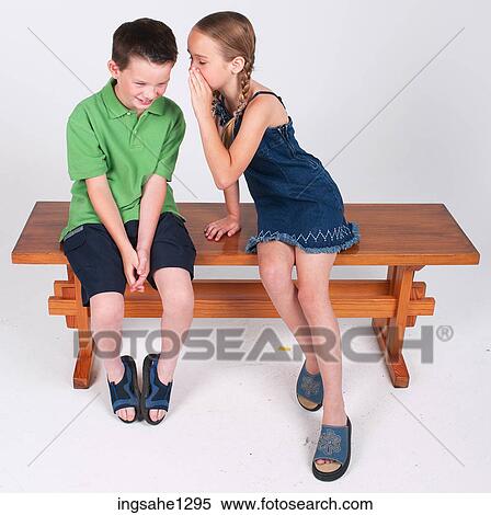 Stock Photography - Children telling secrets . Fotosearch