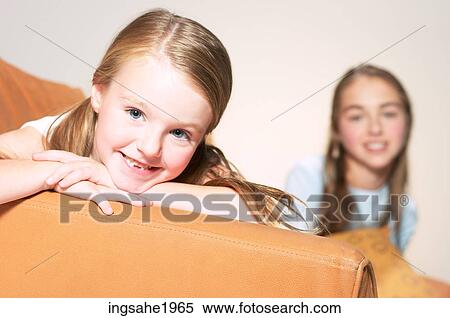 Close-up of girl on sofa BE View Large Photo Image Stock Photography - Close-up of girl on sofa BE. Fotosearch